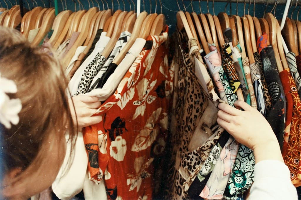 Browsing vintage clothing on the rail